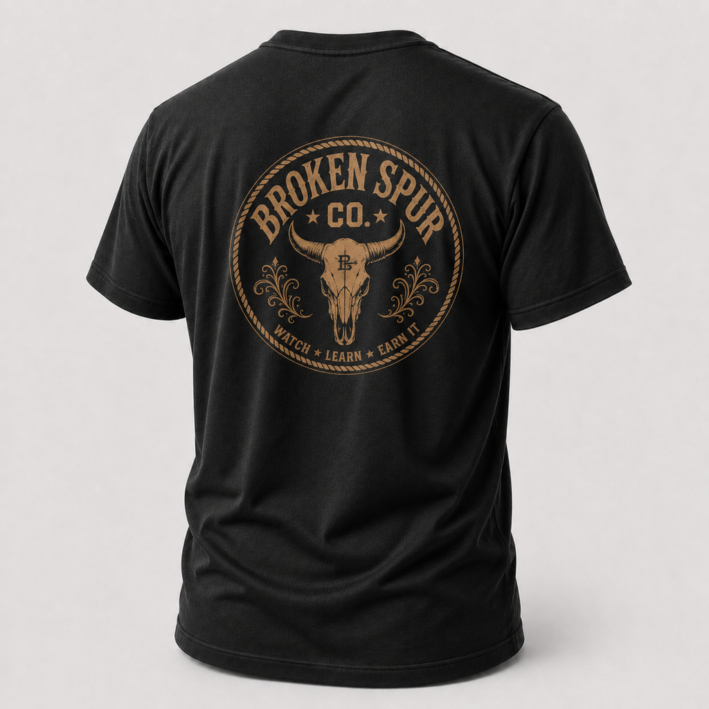 Earn It Western Skull T-shirt, back view featuring a weathered Western skull badge and Watch Learn Earn It message