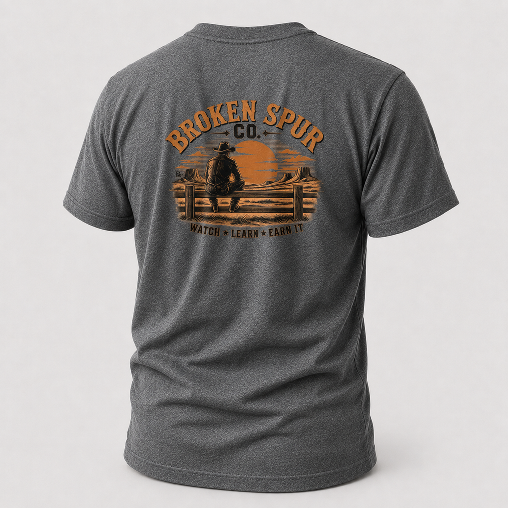 Graphite Heather The Fence Ranch Hand T-shirt, back view featuring ranch hands learning the work along a fence line