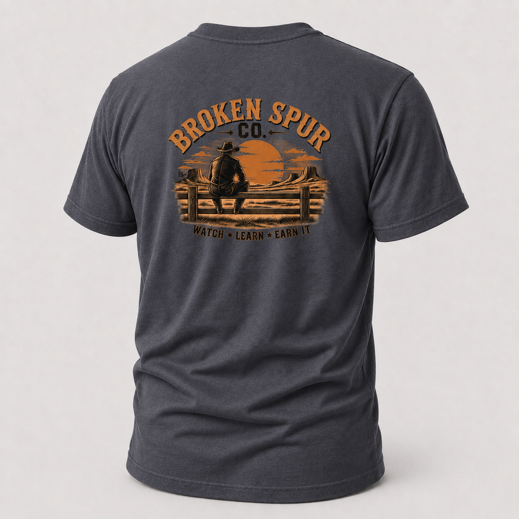 Heather Navy The Fence Ranch Hand T-shirt, back view featuring ranch hands learning the work along a fence line