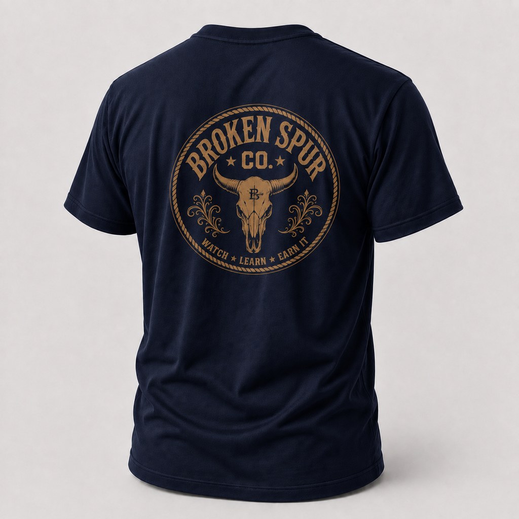 Navy Earn It Western Skull T-shirt, back view featuring a weathered Western skull badge and Watch Learn Earn It message