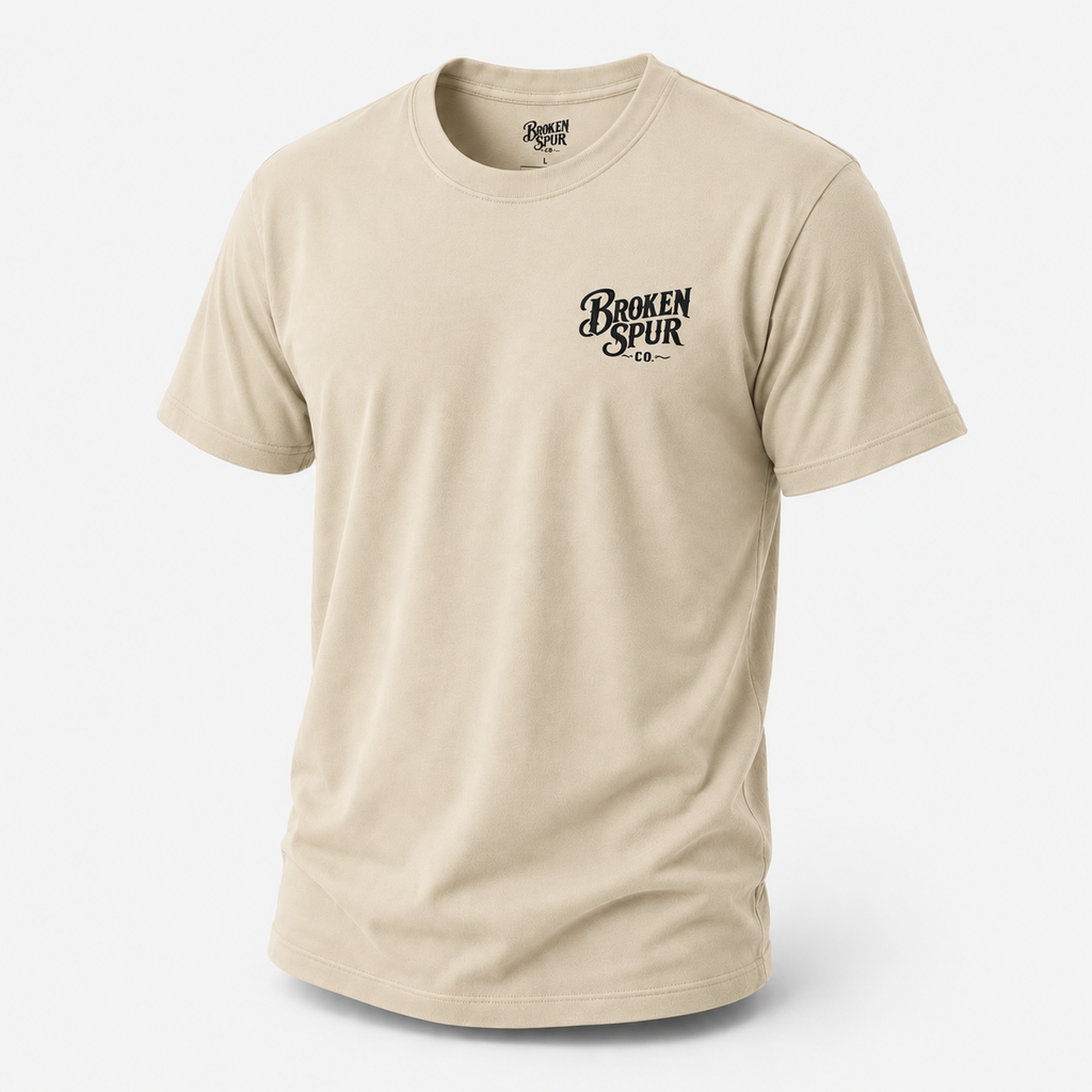Sand A Man of No Man Western Work T-shirt, front view featuring a solitary ranch hand and the No Audience Required design