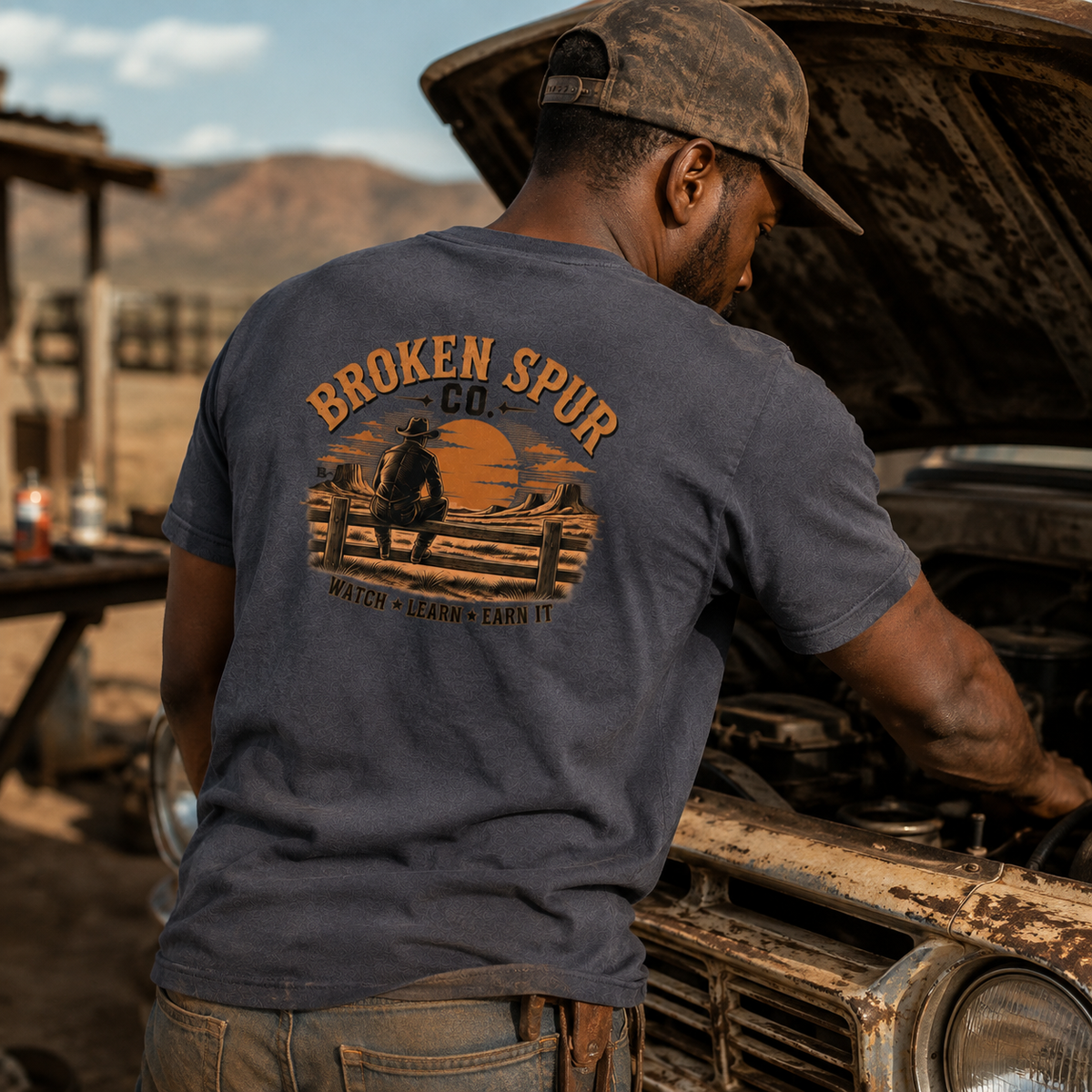 Lifestyle view of The Fence Ranch Hand T-shirt featuring ranch hands learning the work along a fence line