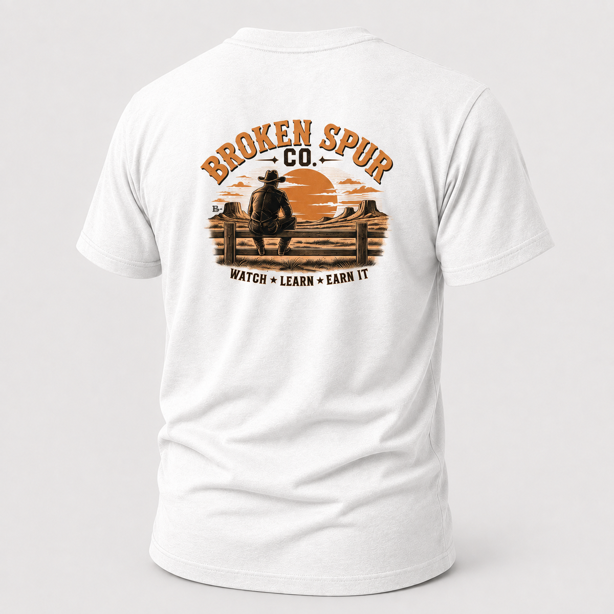 White The Fence Ranch Hand T-shirt, back view featuring ranch hands learning the work along a fence line